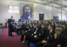 Ian Potts presents school banner installation.